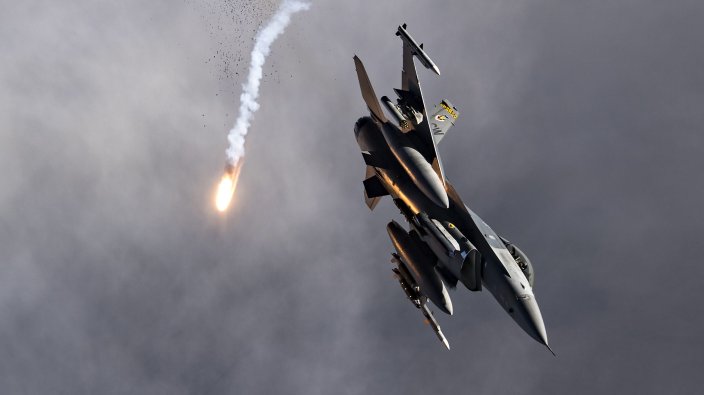 A U.S. Air Force F-16 Fighting Falcon from the 79th Fighter Squadron at Shaw Air Force Base, S.C., releases flares over Afghanistan, Nov. 12, 2019. While assigned to the 455th Air Expeditionary Wing at Bagram Airfield, Afghanistan, the F-16s will help provide decisive airpower through the U.S. Central Command area of responsibility. The airpower the wing provides ensures NATO forces can focus on their mission to train, advise and assist. (U.S. Air Force photo by Staff Sgt. Matthew Lotz)