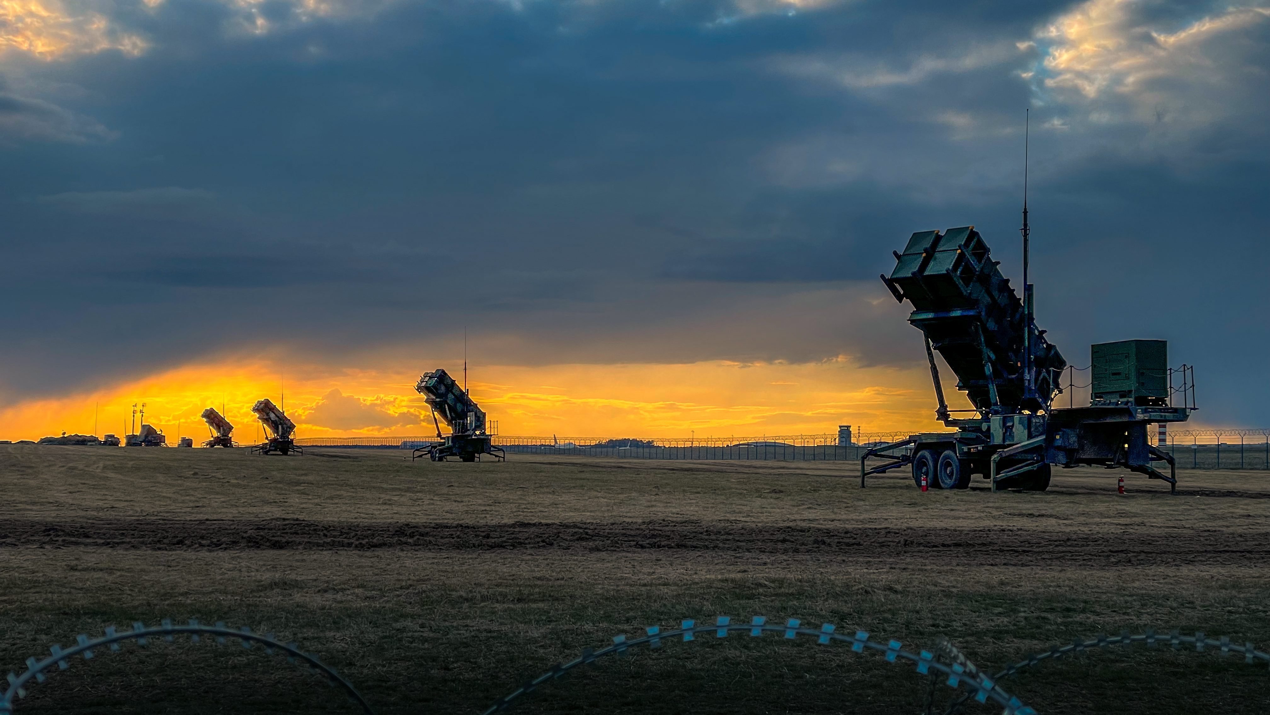 U.S. Patriot missile batteries from the 5th Battalion, 7th Air Defense Artillery Regiment stand ready at sunset in Poland on April 10, 2022. The deployment of these air & missile defense systems is purely defensive. They contribute to the robust shielding provided along NATO’s Eastern flank. The SBAMD systems will protect Allied, populations, territory, and our deployed forces from attack. (U.S. Army photo by Sgt. 1st Class Christopher Smith)