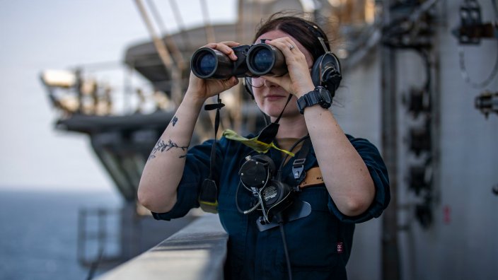 A U.S. Sailor stands watch aboard Nimitz-class aircraft carrier USS Abraham Lincoln (CVN 72), May 17, 2026. Abraham Lincoln is deployed to the U.S. 5th Fleet area of operations to support maritime security and stability in the Middle East. (U.S. Navy photo)