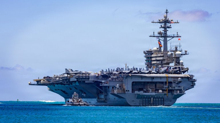 Nimitz-class aircraft carrier USS Theodore Roosevelt (CVN 71) departs Joint Base Pearl Harbor-Hickam, Hawaii, during Exercise Rim of the Pacific 2026, July 7, 2026. Thirty nations, over 30 surface ships, five submarines, 15 national land forces, more than 206 aircraft and 30,000 personnel are participating in RIMPAC in and around the Hawaiian Islands, June 24 to July 31. The world's largest international maritime exercise, RIMPAC provides a unique training opportunity while fostering and sustaining cooperative relationships among participants critical to ensuring the safety of sea lanes and security on the world's oceans. RIMPAC 2026 is the 30th exercise in the series that began in 1971. (U.S. Navy photo by Mass Communications Specialist First Class Luke McCall)