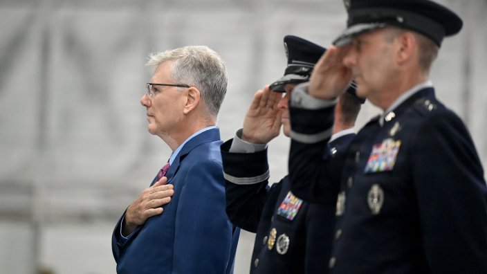 Secretary of the Air Force Troy Meink places his hand over his heart as the National Anthem is played at the Chief of Space Operations Change of Responsibility ceremony, Joint Base Andrews Md., Sept 3, 2026. During the ceremony, Gen. Douglas Schiess was appointed the new Chief of Space Operations. (U.S. Air Force photo by Andy Morataya)
