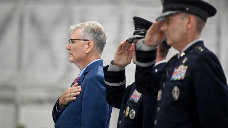 Secretary of the Air Force Troy Meink places his hand over his heart as the National Anthem is played at the Chief of Space Operations Change of Responsibility ceremony, Joint Base Andrews Md., Sept 3, 2026. During the ceremony, Gen. Douglas Schiess was appointed the new Chief of Space Operations. (U.S. Air Force photo by Andy Morataya)
