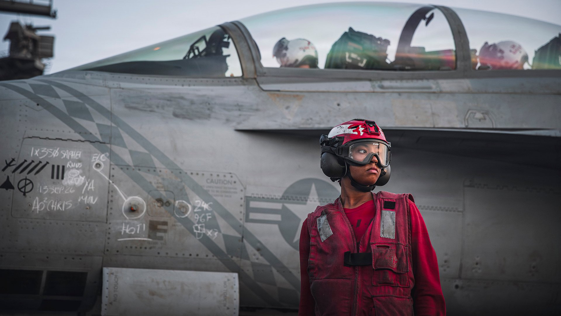 A U.S. Sailor checks ordnance on an F/A-18 Super Hornet, attached to Strike Fighter Squadron (VFA) 102, on the flight deck of Nimitz-class aircraft carrier USS George Washington (CVN 73), Sept. 13, 2026. George Washington is deployed to the U.S. 5th Fleet area of operations to support maritime security and stability in the Middle East. (U.S. Navy photo)