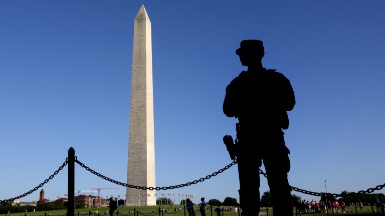 WASHINGTON, DC - JUNE 3: A member of the National Guard keeps watch on the National Mall near the Washington Monument on June 3, 2026 in Washington, DC. (Photo by Kevin Carter/Getty Images)