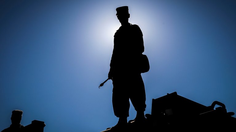 Army Reserve Sgt. Dustin Nelson, a chemical, biological, radiological and nuclear specialist and native of Cleveland, Georgia, assigned to the 327th Chemical Company, 92nd Chemical Battalion, 415th Chemical Brigade, 76th Operational Response Command stands on top of a vehicle and waits for his unit to begin a chemical decontamination mission at Dugway Proving Grounds, Utah, June 19 during Operation Desert Dragon. More than 500 Army Reserve Soldiers from around the country are conducting a variety of specialized training at the base focused on honing Soldiers chemical, biological, radiological and nuclear (CBRN) skill sets and obtaining unit validation as part of a three-week annual exercise known as Operation Desert Dragon. The exercise is designed to be the premiere CBRN validation event for Army Reserve units, and serve as the culminating training event for premobilization and top tier priority units. (Official U.S. Army Reserve photo by Sgt. 1st Class Brent C. Powell)