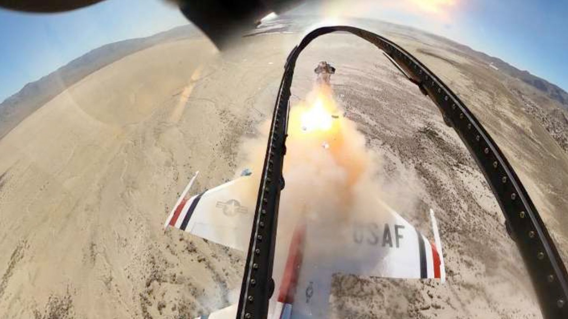 A camera mounted on the jettisoned canopy of an Air Force Thunderbird captures the moment a pilot ejected from one of the team's F-16CM jets, a split-second after the canopy and camera were jettisoned from the jet by explosive charges.