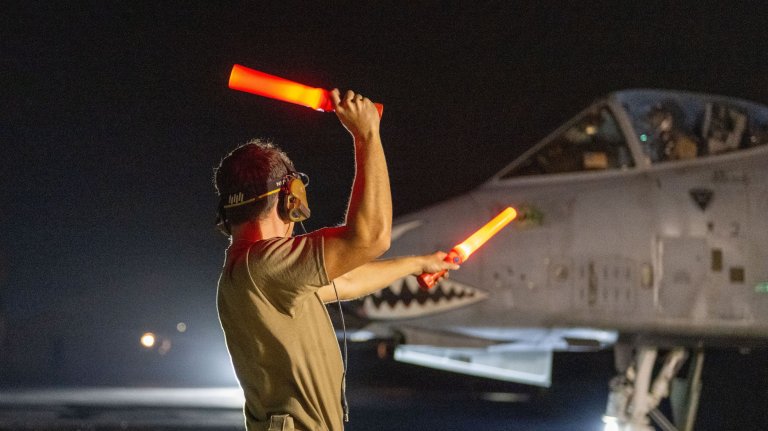 A U.S. Air Force crew chief marshals a U.S. Air Force A-10C Thunderbolt II aircraft at a base in the U.S. Central Command area of responsibility Oct. 8, 2026. (U.S. Air Force photo by Senior Airman Iain Stanley) 