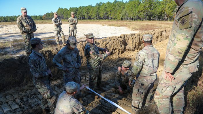 The Unit Ministry Team across XVIII Airborne Corps, collaborate and prepare a designated battlefield temporary interment site in Fayetteville, North Carolina, Oct. 20, 2026. This collaborative effort was conducted as part of a comprehensive Army operational test designed to refine and validate emergency fatality management procedures for future large-scale combat operations. Approximately, 130 Religious Support personnel participated in the training. (Photo by Sgt. 1st Class Ange Desinor)