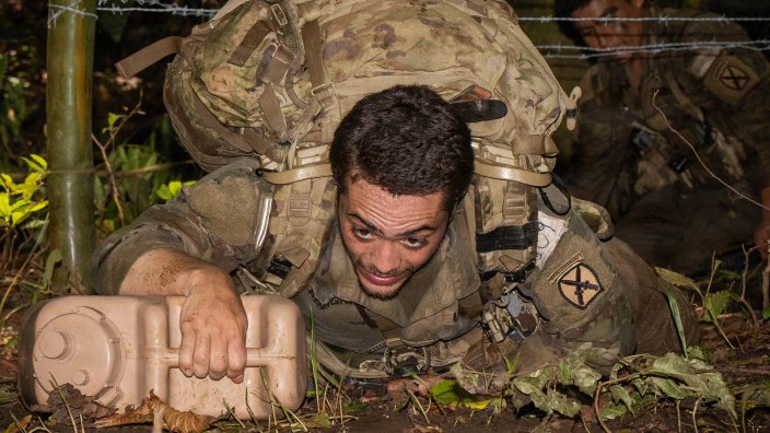 A 10th Mountain Division soldier low crawls during the culminating event at Base Aeronaval Cristóbal Colón, Panamá, March 26, 2026.
