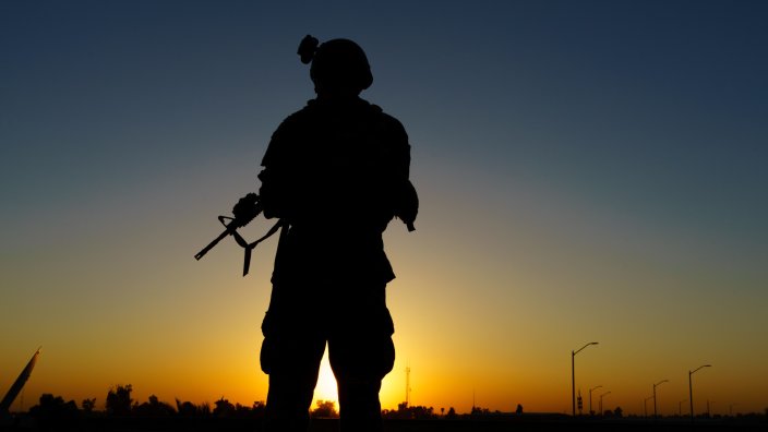 A U.S. Soldier overlooks the sunset during pre-combat checks and inspections in Iraq, Aug. 3, 2020. U.S. forces are currently deployed in support of Operation Inherent Resolve working by, with and through partner forces to defeat ISIS in designated areas of Iraq and Syria while establishing conditions for follow-on operations to increase regional stability. (U.S. Army Photo by Staff Sgt. Gregory T. Summers) 