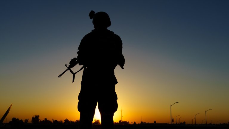 A U.S. Soldier overlooks the sunset during pre-combat checks and inspections in Iraq, Aug. 3, 2020. U.S. forces are currently deployed in support of Operation Inherent Resolve working by, with and through partner forces to defeat ISIS in designated areas of Iraq and Syria while establishing conditions for follow-on operations to increase regional stability. (U.S. Army Photo by Staff Sgt. Gregory T. Summers) 