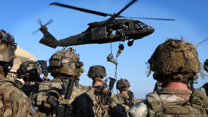 U.S. Army Soldiers assigned to 1st Battalion, 502nd Infantry Regiment, 2nd Brigade Combat Team, 101st Airborne Division (Air Assault) and 3rd Battalion, 501st Aviation Regiment, Combat Aviation Brigade, 1st Armor Division conduct Fast Rope Insertion and Extraction System (FRIES) opportunity training to become certified and create a standard of FRIES operations across the battalion, at Mihail Kogălniceanu Airbase in Romania, Nov. 10, 2022. Soldiers continue to reinforce NATO’s eastern flank and reaffirm the commitment to the European continent by engaging in exercises like FRIES, which increases interoperability and readiness between Allied and Partner nations. (U.S. Army photo by Sgt. Khalan Moore)
