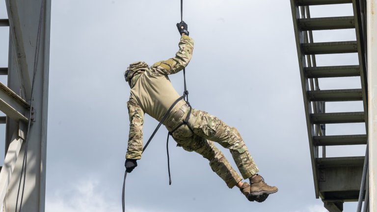A U.S. Air Force Tactical Air Control Party (TACP) Airman assigned to the 6th Combat Training Squadron, Detachment 2, rappels during rappel familiarization training at Joint San Antonio–Camp Bullis, Texas, June 5, 2025. TACP training is rigorous and intensive, covering a wide range of skills, including navigation, communications, small unit tactics, and close air support. (U.S. Air Force photo by Melissa Hydrick)