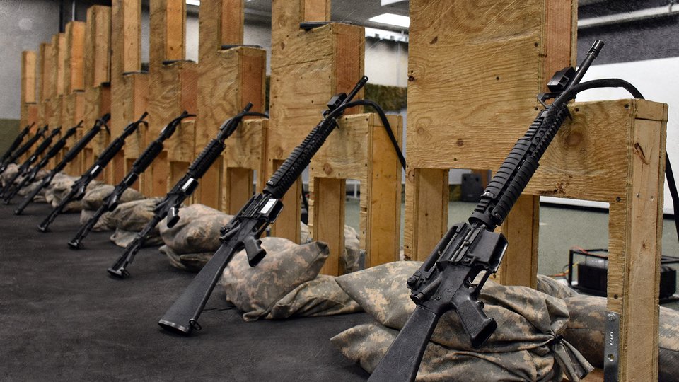 A November 2025 photo showing rifles at rest along an Engagement Skills Trainer firing line.