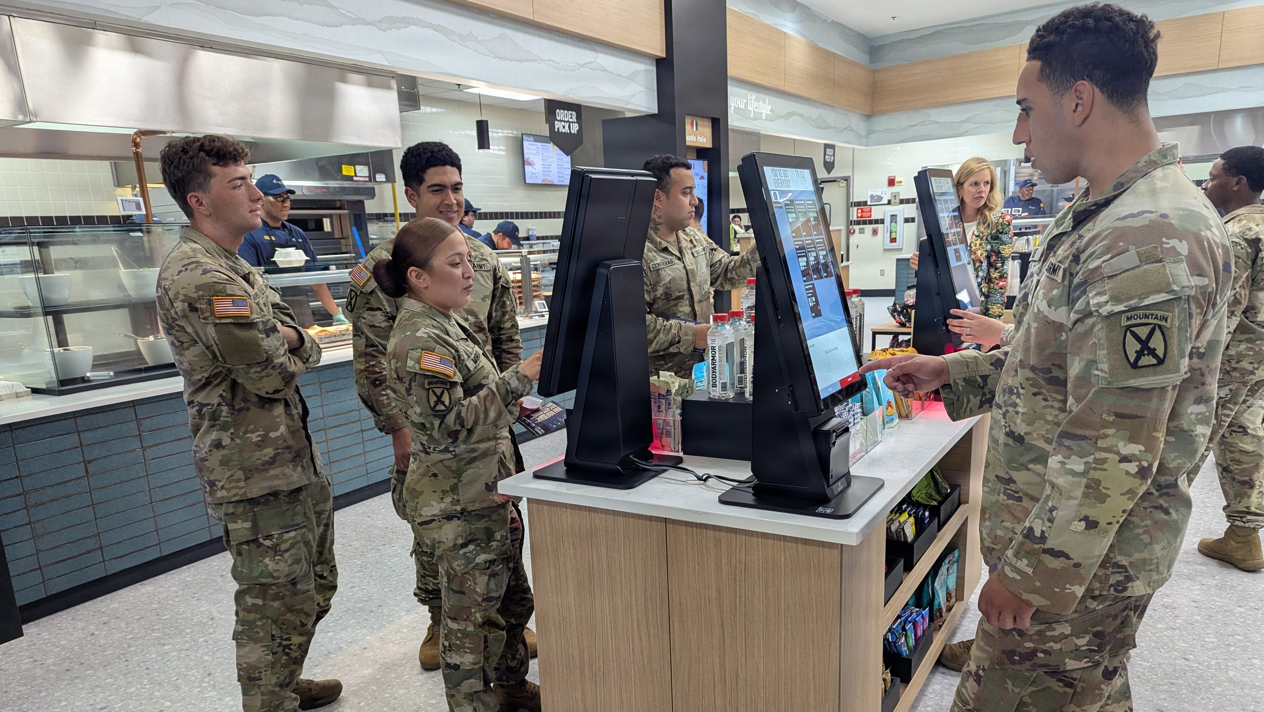 Soldiers have a wide variety of meal options to choose from as they swipe and tap their order at the touchscreen kiosk inside the Belvedere Bistro on July 27, 2026. During the three-day soft opening, a select number of Soldiers helped the Bistro staff test their services and workflow before the grand opening of the Army’s newest Campus-Style Dining Venue (CSDV) at Fort Drum, New York. (Photo by Mike Strasser, Fort Drum Garrison Public Affairs)