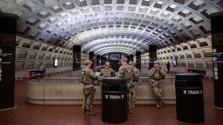 WASHINGTON, DC - MAY 16: U.S. Army National Guard members stand inside the Metro Center subway station in the heart of downtown on May 16, 2026 in Washington, DC. (Photo by Chip Somodevilla/Getty Images) 
