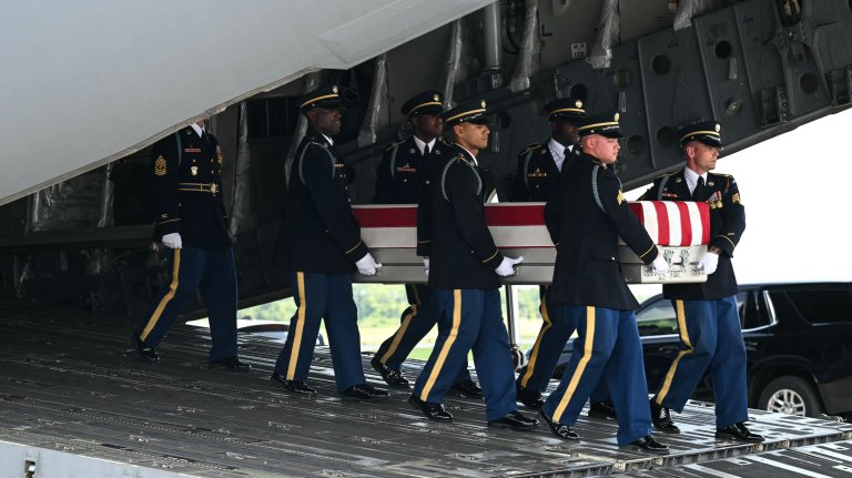 A US Army carry team carries the flag-draped transfer case containing the remains of Sgt. Michael Emmanuel Swinton, 30, of Fayetteville, North Carolina, during a dignified transfer solemn event for US service members killed during operations in the Middle East, at Dover Air Force Base in Dover, Delaware, on July 22, 2026. Swinton was killed in action on July 19 at at Erbil Air Base in Iraq. (Photo by SAUL LOEB / AFP via Getty Images)