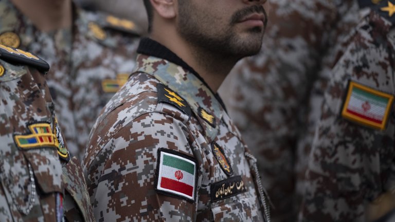 Iranian Army servicemen take part in the opening ceremony of the second city-square military training camp for ''self-sacrificing'' forces in downtown Tehran, Iran, on October 3, 2026. The camp was established by the Basij paramilitary force, with personnel from the Islamic Republic of Iran Army responsible for training the volunteers. (Photo by Morteza Nikoubazl/NurPhoto via Getty Images) 